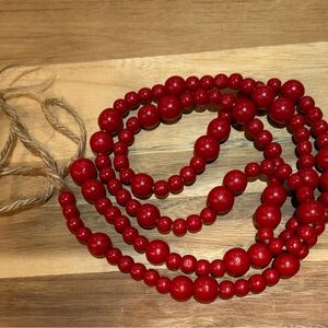 Red Beaded Christmas garland from threshold